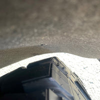 Fender liner relocation