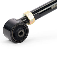 

Adjustable rear trailing arms suspension component