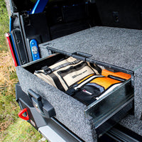 

ARB roller drawer open showing secure storage space